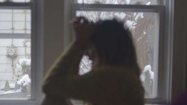 The blurred image of a woman overwhelmed by depression