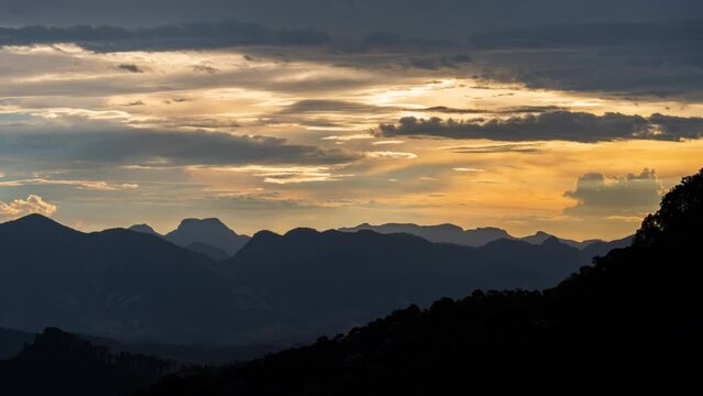 Spectacular Mountain Range Sunset Time-Lapse with Silhouettes and Backlit Clouds