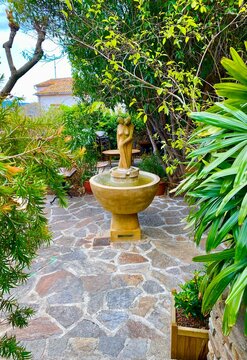 fountain in the garden of the town bormes les mimosas