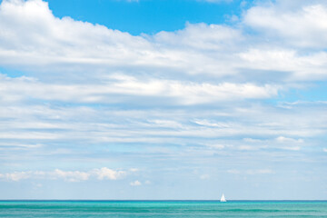 Fototapeta na wymiar horizon view of daylight sky and summer yacht
