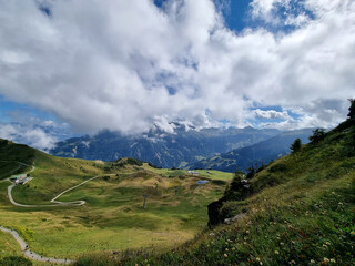 Green mountains, mountain panorama, bright sky, mountains, grass, green landscape. Cloudy sky in...