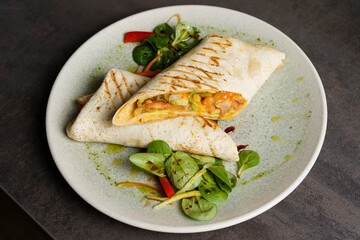 Wrapped Burrito with Beans and Vegetables on a Plate