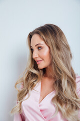Fototapeta premium portrait of a beautiful blonde woman in pink clothes