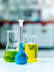 Glass chemistry in a laboratory background. Selective focus
