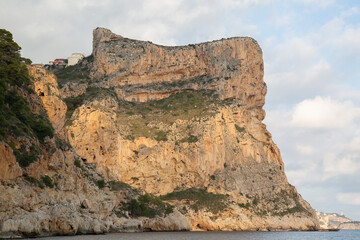 Landscape View at Moraig Cove Beach with Cliff; Alicante; Spain - 591559521