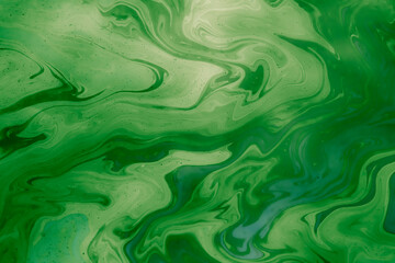 Fototapeta premium green stains of gasoline oil on the water, iridescence