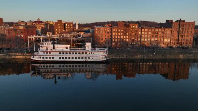 Aerial view of downtown Troy, New York at sundown from above the Hudson River