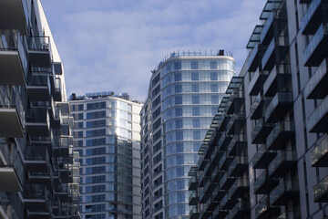 Obraz premium Facades of large residential buildings against the blue sky.