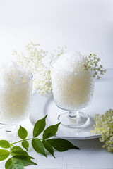 Elderflower lemonade or champagne granita with freshly picked elderberry flowers. Granita dessert with elderflower cordial syrup