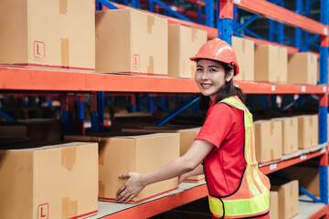 Portrait of warehouse worker smiling and happy in the warehouse., Industrial and industrial concept.
