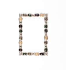 photo frame framed with colored stones isolated on white background