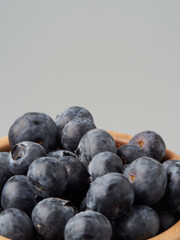 Fresh organic blueberries in a bowl closeup view