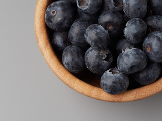 Fresh organic blueberries in a bowl closeup view