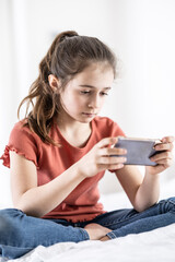Pre-teen girl is addicted to being online, having fomo and having her phone in hands at all times
