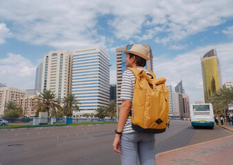 travel to the United Arab Emirates, Happy young asian female traveler with backpack and hat in...