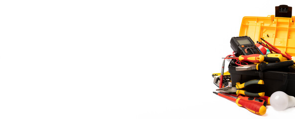 Fototapeta premium Composition with electrician tools and accessories isolated on white background. Tool box. Electrician's tool. Banner.MOCKUP