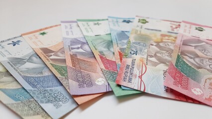 Indonesia banknotes paper money rupiah new series. Indonesian currency IDR for payments and buying and selling isolated on white background