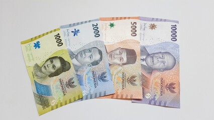 Indonesia paper money rupiah new series. Indonesian currency IDR for payments and buying and selling, piles of money, isolated on white background