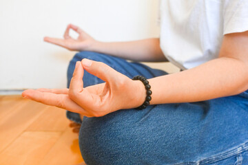 Woman practising spiritual meditation praying, mindfulness mental healthcare, spiritual new age lifestyle in sacred space daily routine rituals. Training unlock power subconscious mind.