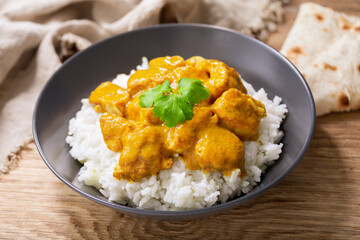 plate of chicken with curry sauce and rice