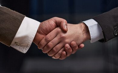 business people handshake over wooden table. businessmen agreement and partnership concept.