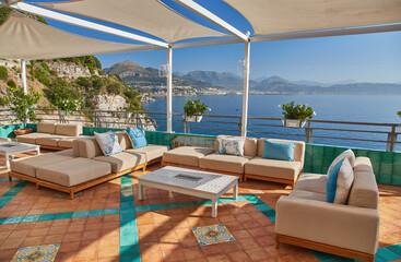 Fototapeta premium Summer outdoor cafe at old tourist european city in Italy on Amalfi coast