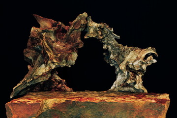 Obraz premium A Rock Shelf for a Product Display, Showing an Artistic Effect to the Stone Surface with a Dried Carbon Tree Root Arch. 