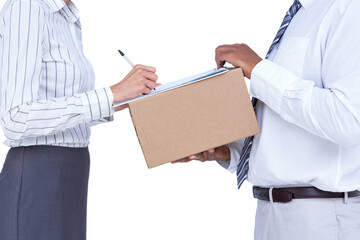 Businessman taking signature on document from businesswoman