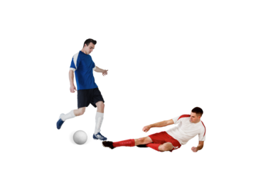 Football players tackling for the ball