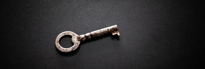 Old key on a dark background