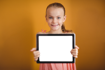 Portrait of girl showing digital tablet