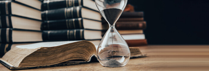 hourglass with book