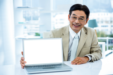 Smiling asian businessman showing his laptop