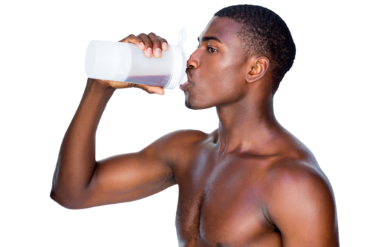 Side view of a sporty man drinking protein