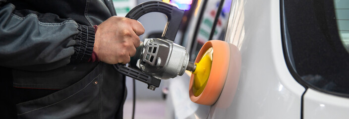 auto mechanic buffing car autobody