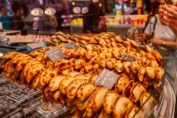 Pastry products on the market stall. Different semi healthy pastries. Barcelona, Catalonia,Spain.