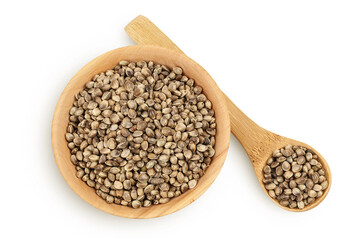 Hemp seeds in wooden bowl isolated on white background with full depth of field. Top view. Flat lay