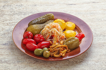 Plate with pickled vegetables and mushrooms
