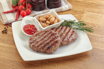 Grilled beef burger cutlet with sauce