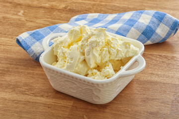 Italian soft mascarpone cheese in the bowl