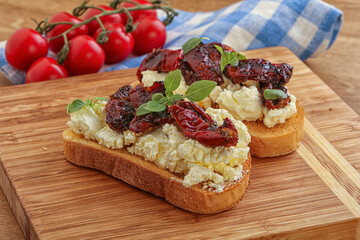 Bruschetta with soft cheese and tomato