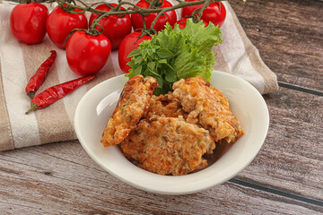 Fried salmonn cutlet in the bowl