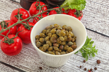 Marinated green capers in the bowl