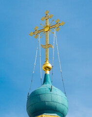 golden cross on a church