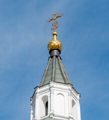 golden cross on a church