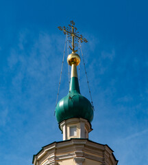 Fototapeta na wymiar golden cross on a church