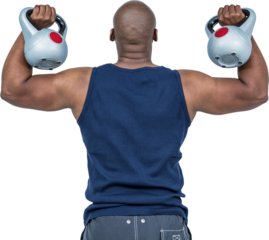 Muscular man exercising with kettlebell