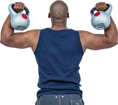 Muscular man exercising with kettlebell