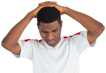 Disappointed football fan looking down