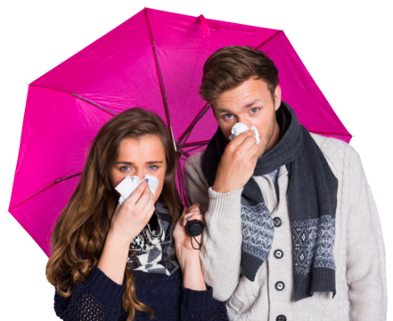 Couple blowing nose while holding umbrella